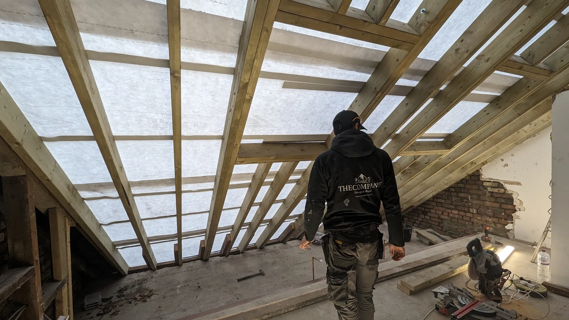 Loft conversion in progress with new roof timbers